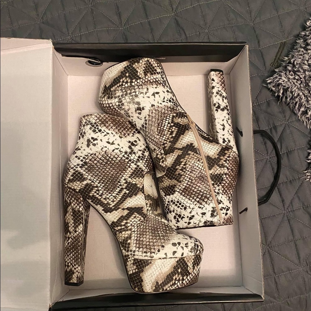 Snake skin heeled boots